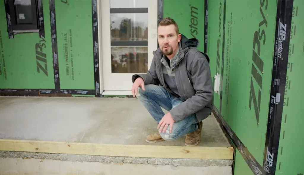 Chase on porch of energy efficient home