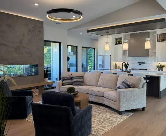 Open floorplan living space with fireplace and kitchen